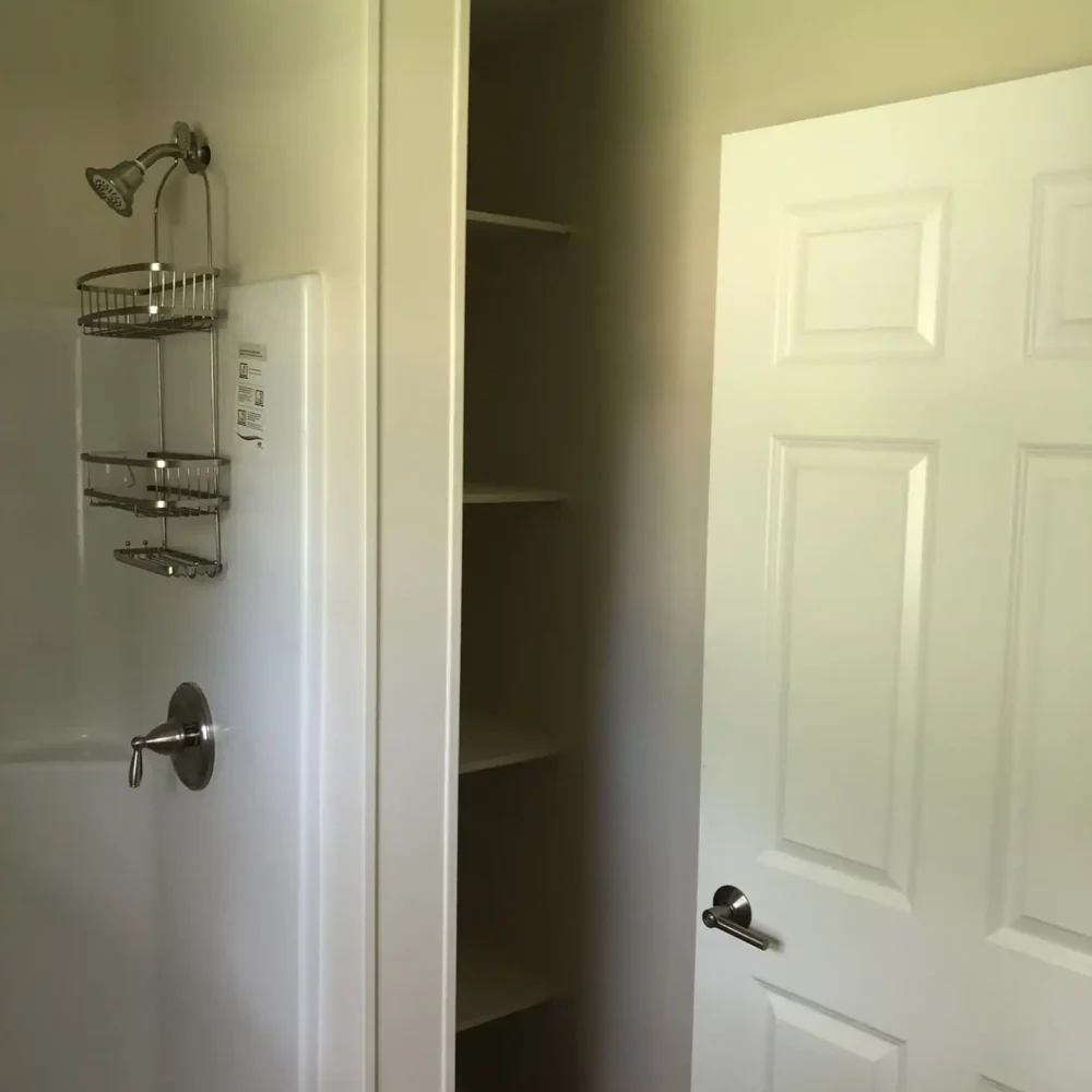 Remodeled Shower and Shelf Space in a Bathroom